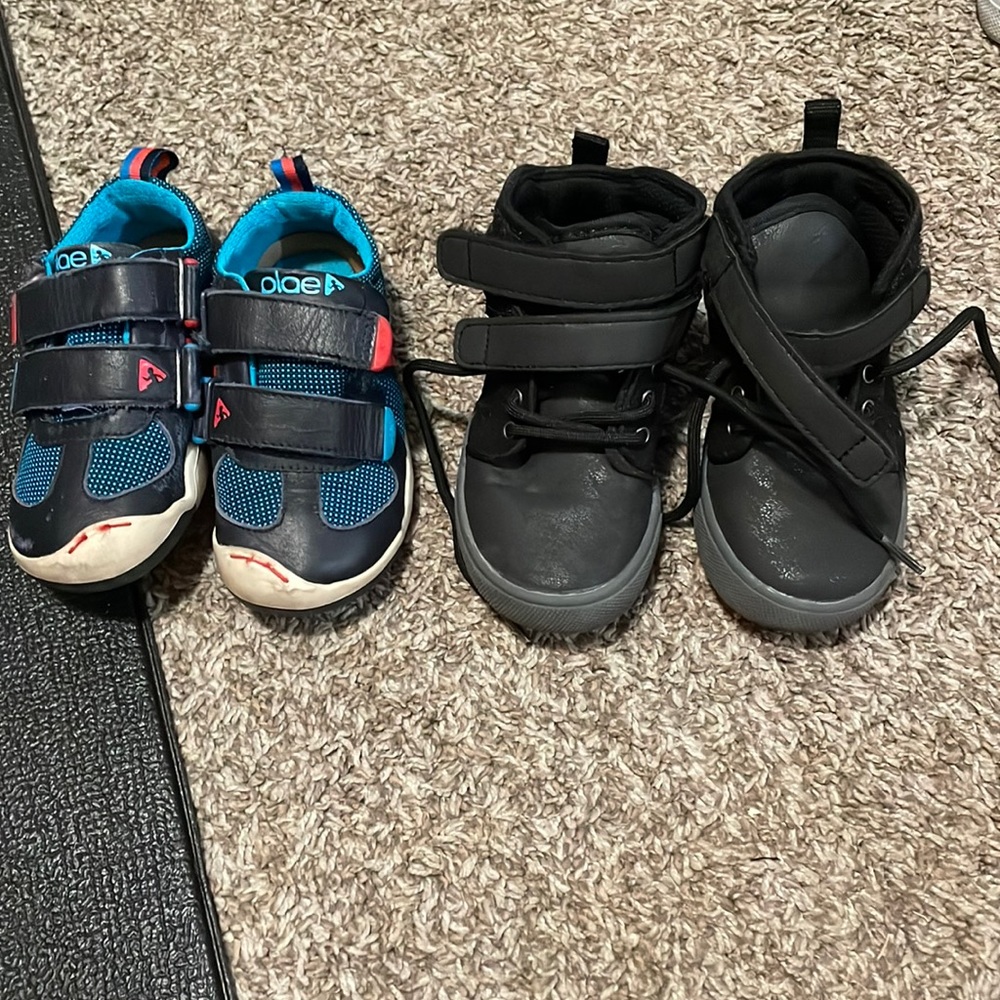 Two pairs of little boys shoes.